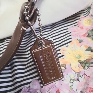 Cream and dark brown leather COACH handbag.